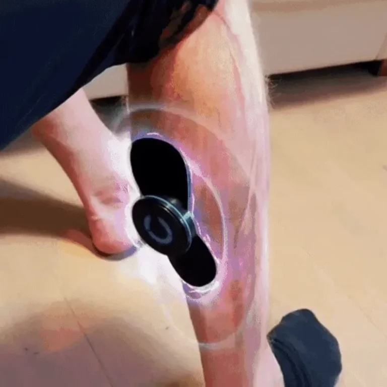 Nooro Whole Body Massager on guy's leg